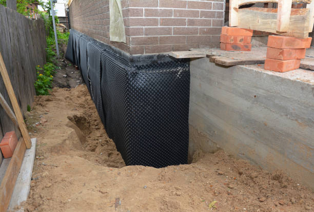 Happy homeowners after waterproofing job in Burr Oak